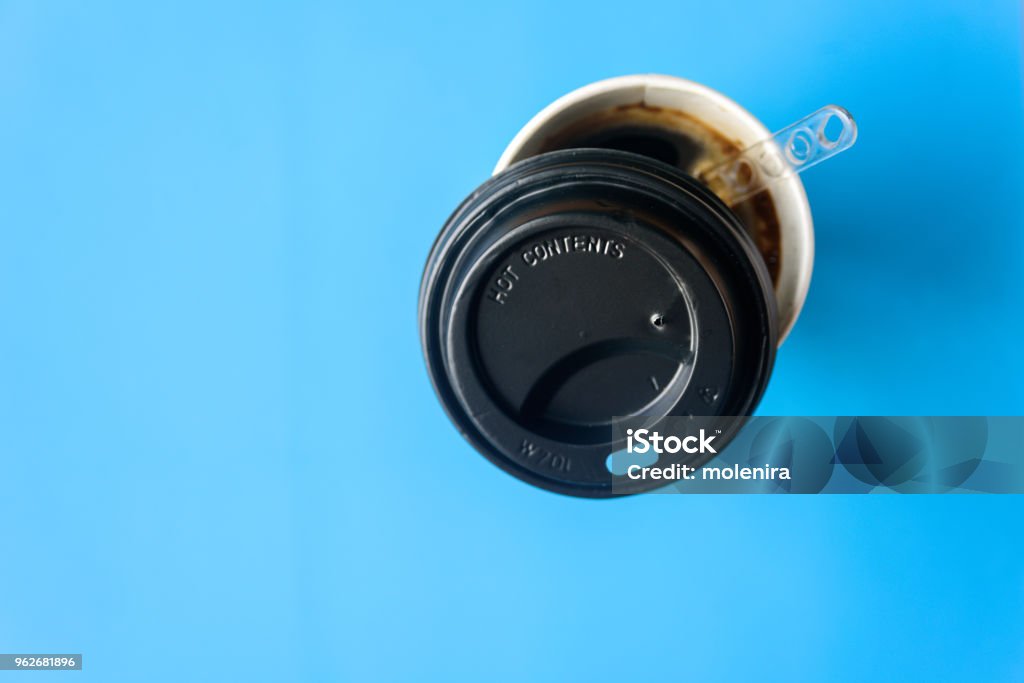 Instant coffee in paper cup with cap Instant coffee in paper cup with cap on light blue pastel background Above Stock Photo