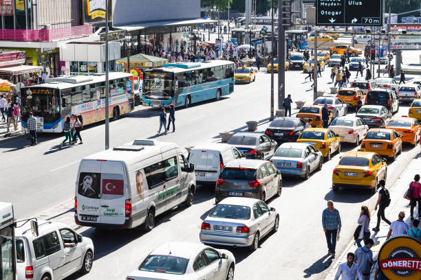 people and car traffic on street in Ankara city stock photo