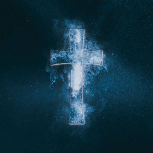istock Christian cross symbol. Abstract night sky background. 962682596