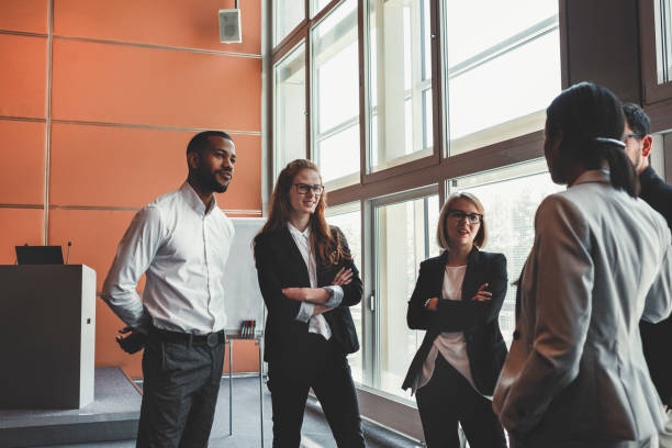 istock Conference room with business people on coffee break 962687156
