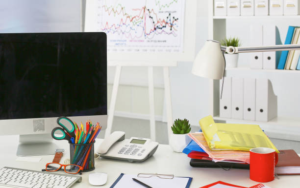 istock Workplace with notebook laptop Comfortable work table in office windows and city view 962688410