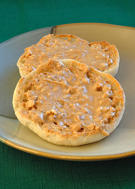 English Muffin with Peanut Butter  english muffin stock pictures, royalty-free photos & images