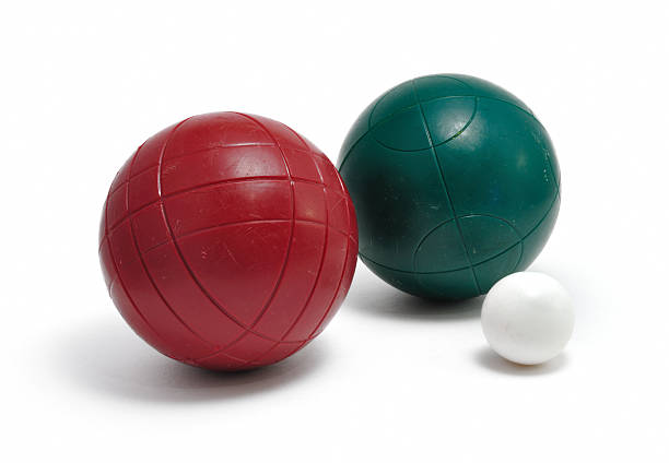Red and Green Bocce Balls & Pallino (Jack or Boccino) stock photo