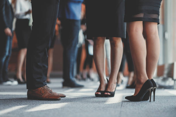 istock Business people standing in the office, coffee break 962691728