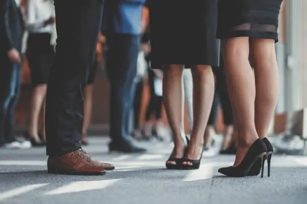 Business people standing in the office, coffee break.