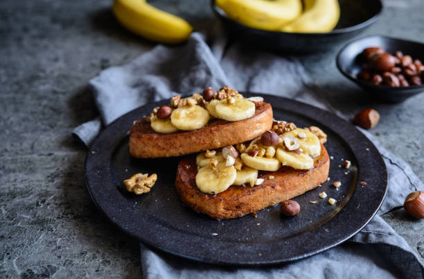 istock Cinnamon French toast with banana, walnut and hazelnut 962692824
