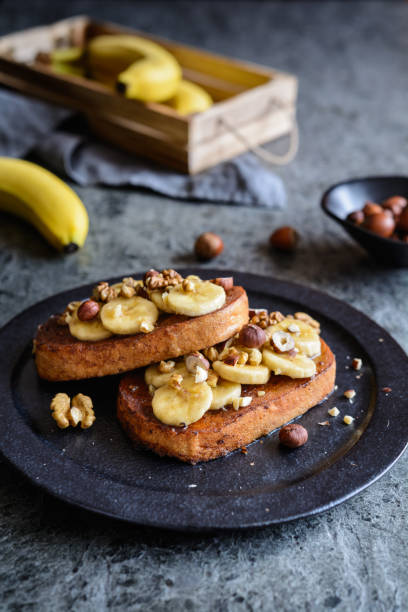 istock Cinnamon French toast with banana, walnut and hazelnut 962692838