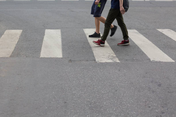 istock People walk pedestrian crossing 962697884