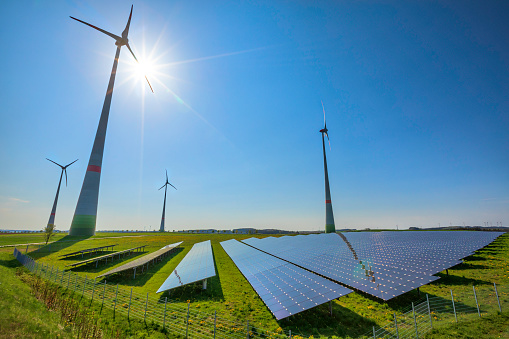 renewable energy: wind turbines and modern solar panels (HDRi)