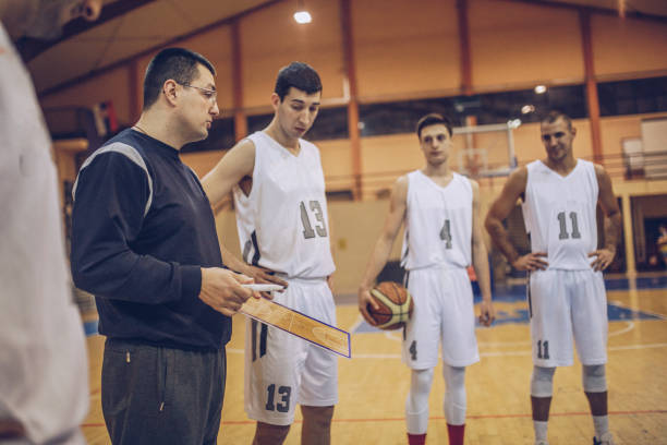 istock Coach talking to a basketball players 962704986