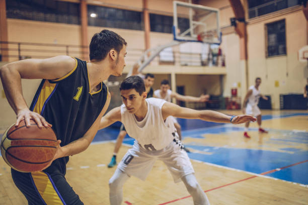 istock Male basketball players during game 962705126