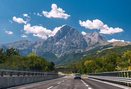 An highway in Italy; the mountain Gran Sasso in background