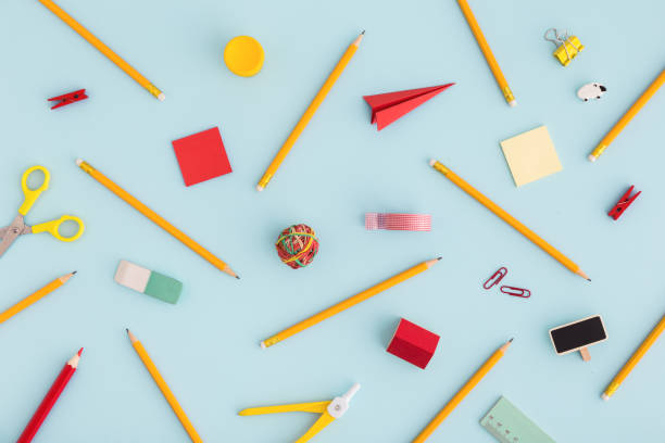 istock Diverse school supplies on blue background. Back to school. 962717434