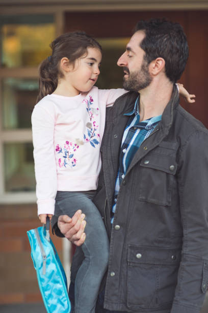 istock Dad drops little girl off at school 962721254