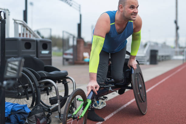 istock Adaptive athlete training on his racing wheelchair at a stadium track 962721886