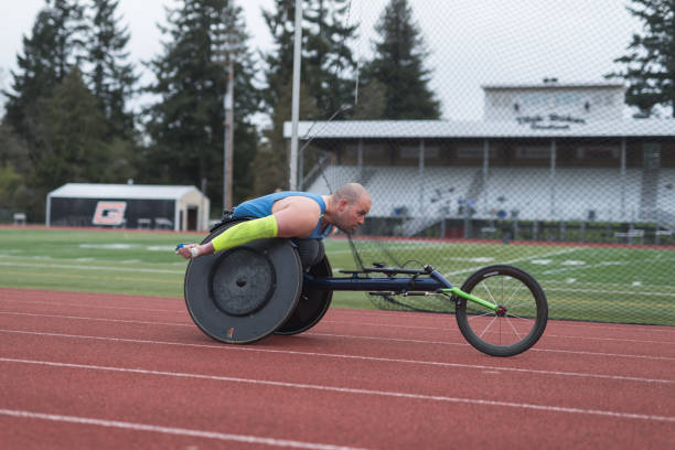 istock Adaptive athlete training on his racing wheelchair at a stadium track 962721888