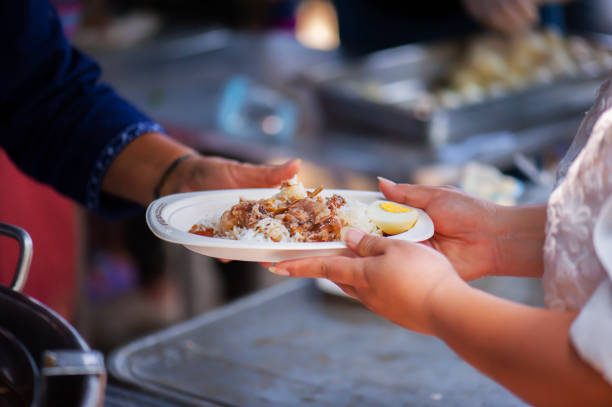 istock Feeding the poor Helping each other in society 962734814