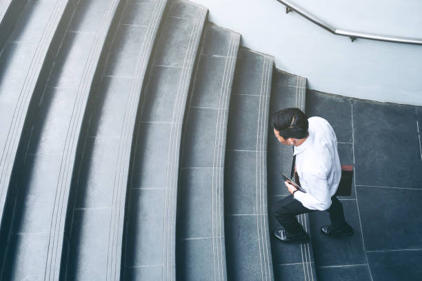 istock Successful businessman running fast upstairs Success concept 962735082