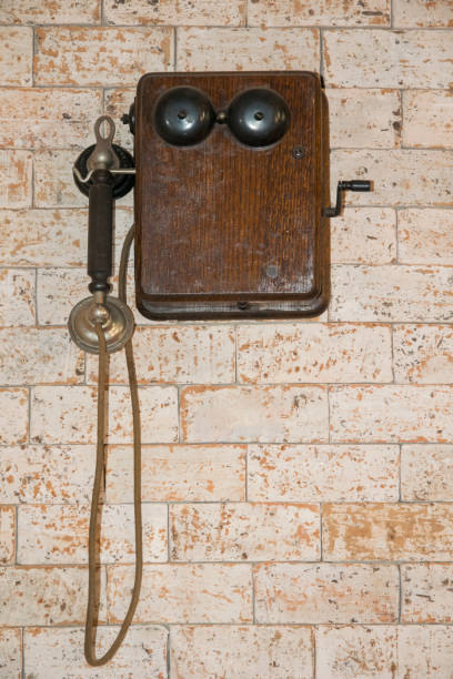 istock Vintage telephone on brick wall. 962736090