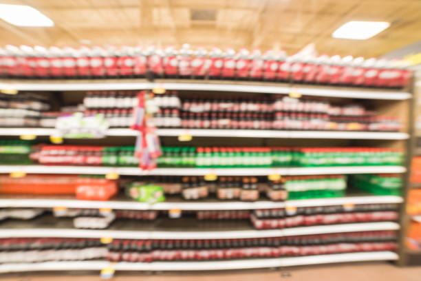 istock Abstract blurred background soft drinks aisle in American store 962738432