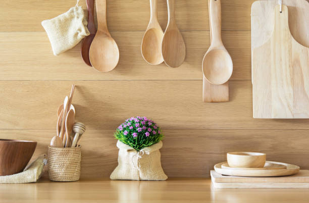 istock Lovely plastic flower bouquet in the wood kitchen. 962746702