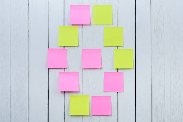 istock Many colorful sticky note, post note or post-it on white wooden vintage background 962747166