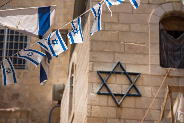 istock Israeli flag blowing in the wind 962753864