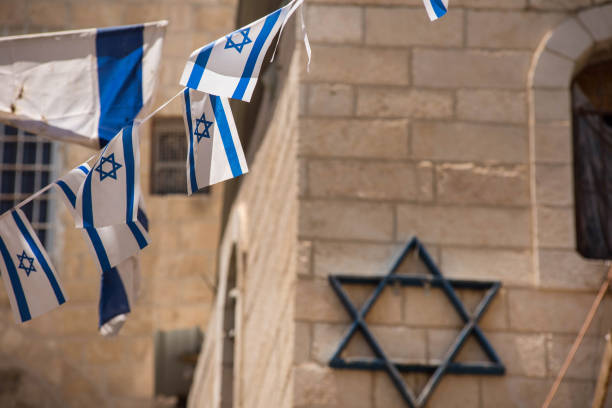 istock Israeli flag blowing in the wind 962753874