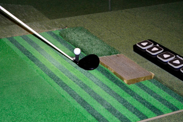 istock Golf balls and clubs on the screen golf driving range 962754298