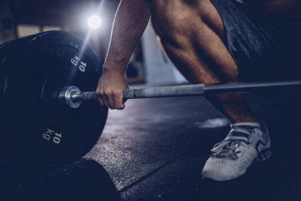istock Man gripping the barbell 962754602