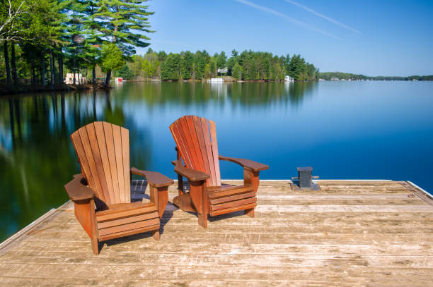 istock Muskoka chairs on a wooden dock 962759512