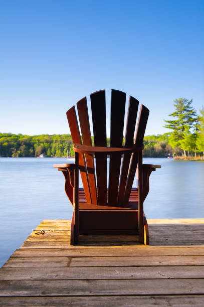 istock Muskoka chairs on a wooden dock 962759570