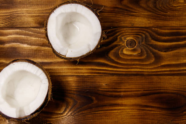 istock Fresh ripe coconut on rustic wooden table 962759618