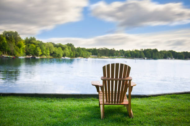 istock Muskoka chairs on a green lawn 962759636