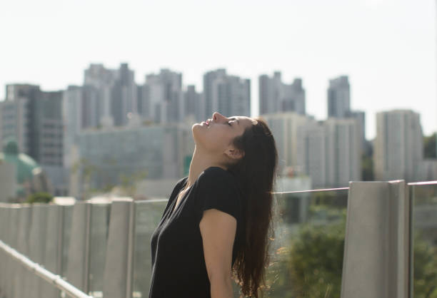 istock Pretty Woman with Facing Sky. Portrait. Background. 962764856