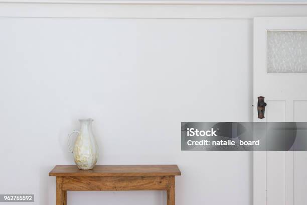 White Jug On Wooden Side Table Stock Photo - Download Image Now - Table, Wall - Building Feature, Indoors