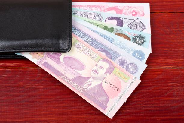 istock Money from Iraq in the black wallet 962765864