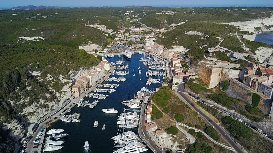Aerial photograph of Bonifacio port in South of Corsica. Harbour. Limestone cliffs. Fortress.