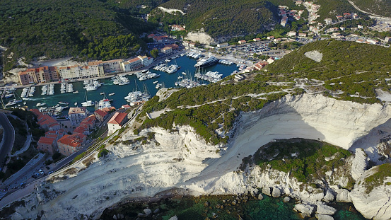 Aerial photograph of Bonifacio port in South of Corsica. Harbour. Limestone cliffs. Fortress.