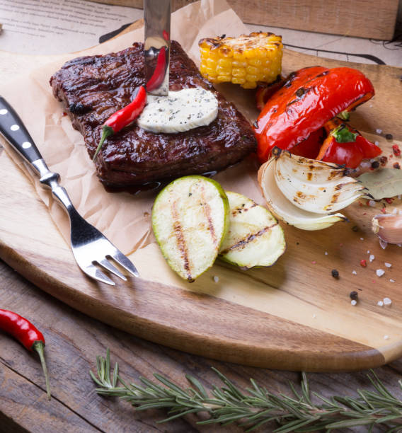istock Roasted beef steak served with grilled vegetables 962770434