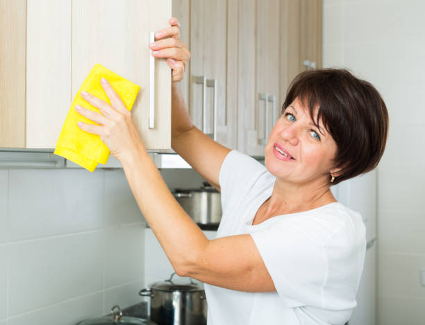 istock senior woman cleaning 962771432