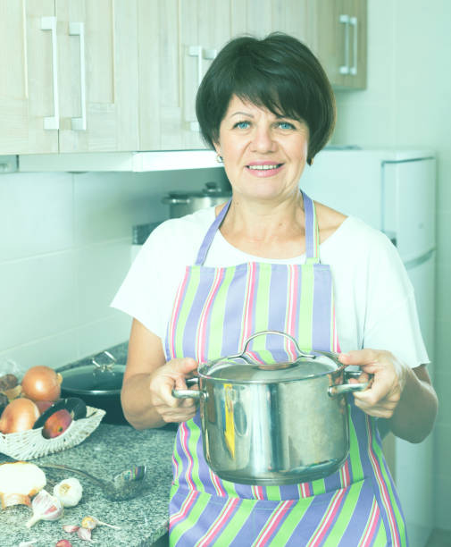 istock mature woman kitchen soup 962771452