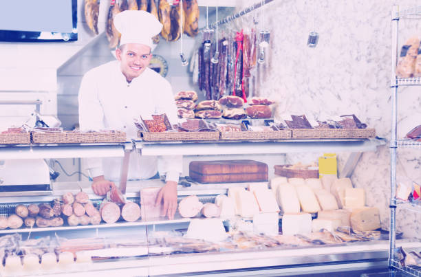 istock Glad professional cook laying out food 962772096