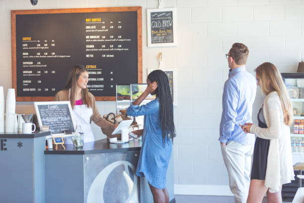 istock Customers ordering at a coffee shop counter 962775862