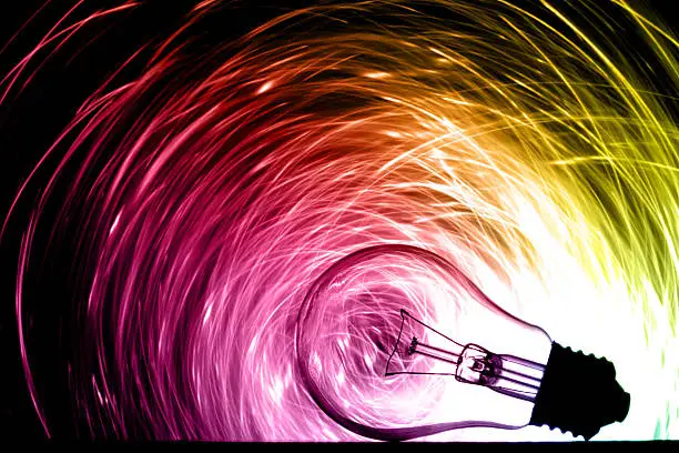 Photo of Abstract light bulb shining various colors