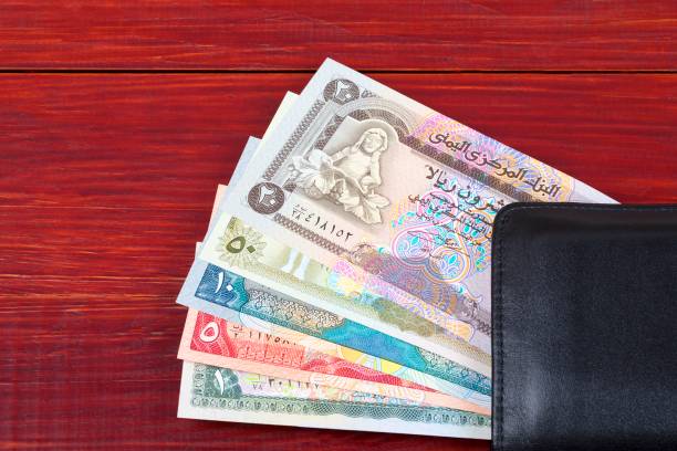 istock Money from Yemen in the black wallet 962777144