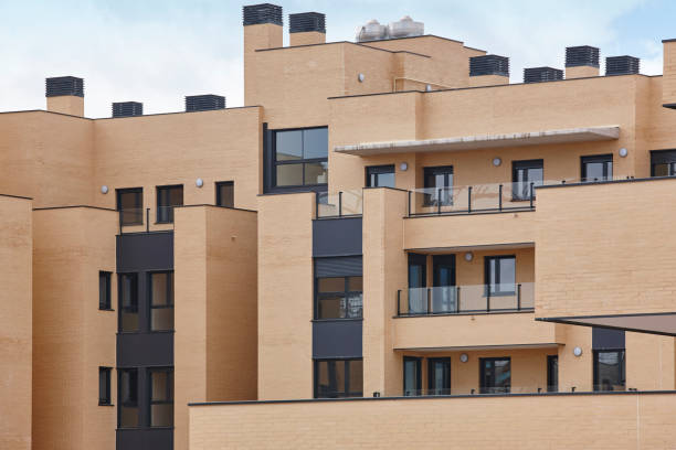 istock New brick building exterior facade with terraces. Construction. Buy 962777820