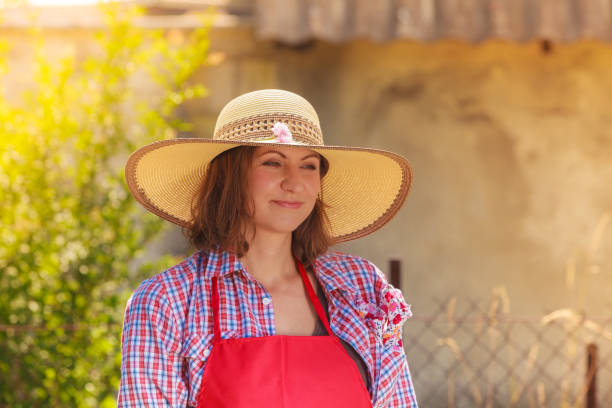 istock Portrait woman with hat in garden 962778286