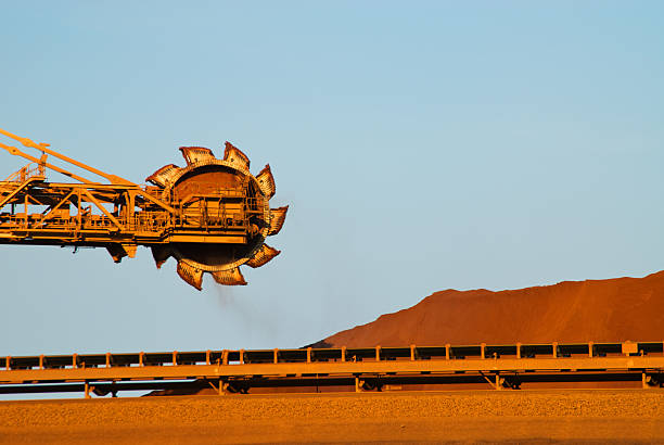 Reclaimer on iron ore mine site Iron Ore Mine Site Port Hedland Western Australia mining natural resources photos stock pictures, royalty-free photos & images