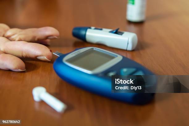 Testing For High Blood Sugar Stock Photo - Download Image Now - Diabetes, Mother, Senior Adult
